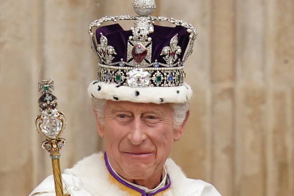 King Charles wearing the Imperial State Crown leaving his coronation ceremony in May (PA)