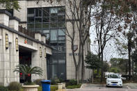 A vehicle parked outside the I-Soon office building, also known as Anxun in Mandarin, is pictured in Chengdu in southwestern China's Sichuan Province on Wednesday, Feb. 21, 2024. Chinese police are investigating an unauthorized and highly unusual online dump of documents from a private security contractor linked to China’s top policing agency and other parts of its government. (AP Photo/Dake Kang)