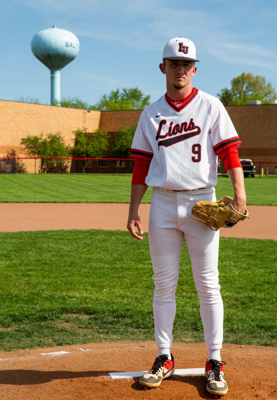 Liberty Union senior Jacob Miller stands on the pitchers mound on the baseball diamond at Liberty Union High School in Baltimore, Ohio on May 11, 2022. Jacob has been scouted for his pitching talents by Major League Baseball scouts and early projections show he will be drafted in the first round of the Major League Baseball Draft in July 2022.