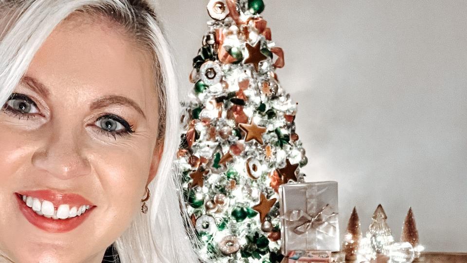 Louise Pentland in front of Christmas tree