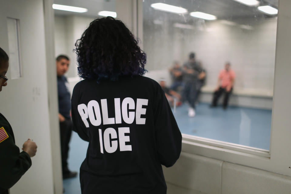 Undocumented immigrants wait in a holding cell at a U.S. Immigration and Customs Enforcement processing center in lower Manhattan