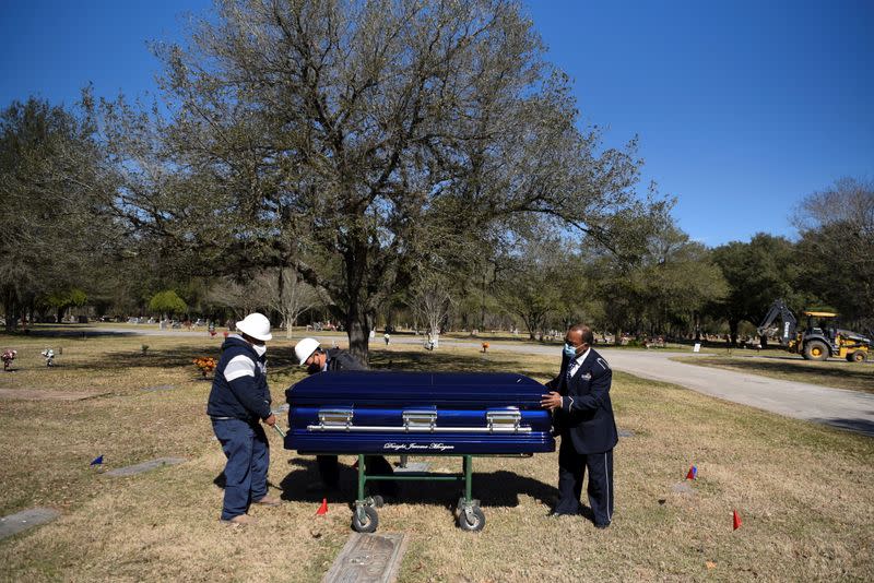 The Wider Image: 'I just ask God to help me': Texas funeral home crushed by death as U.S. COVID toll nears 500,000