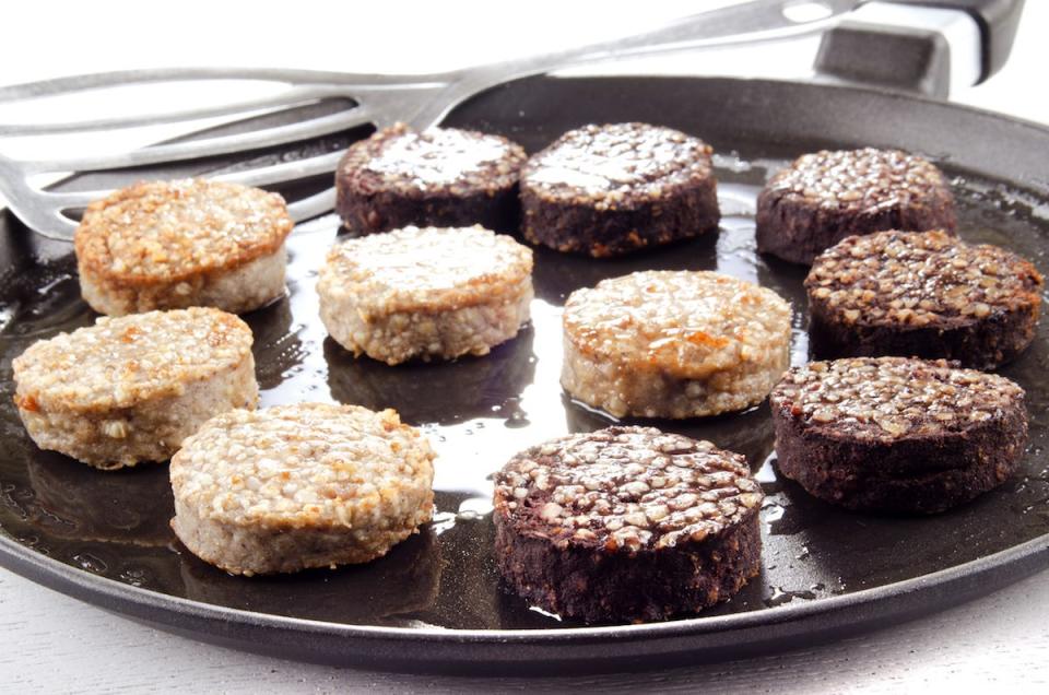 white pudding and black pudding on a plate