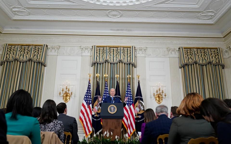 Mr Biden in the State Dining Room at the White House - AP Photo/Susan Walsh