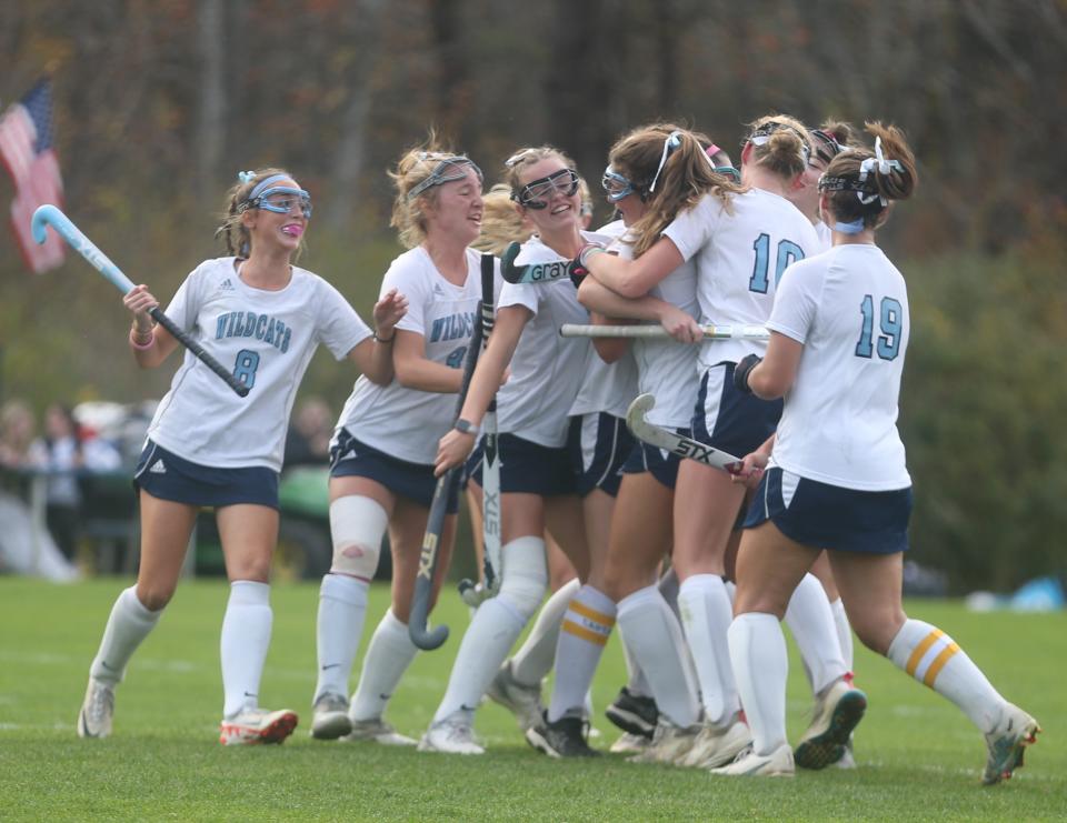 Members of the York High School field hockey team celebrate after Ava Brent's third goal of the game in Wednesday's 4-1 win over Cape Elizabeth in a Class B South first-round game.