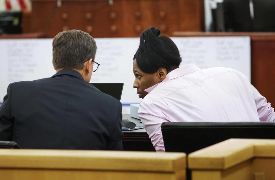 Timothy Huff, right, speaks to attorney Patrick Curran on Monday, June 27, 2022. Huff was found guilty of capital murder the 2018 shooting death of Fort Worth police Officer Garrett Hull.