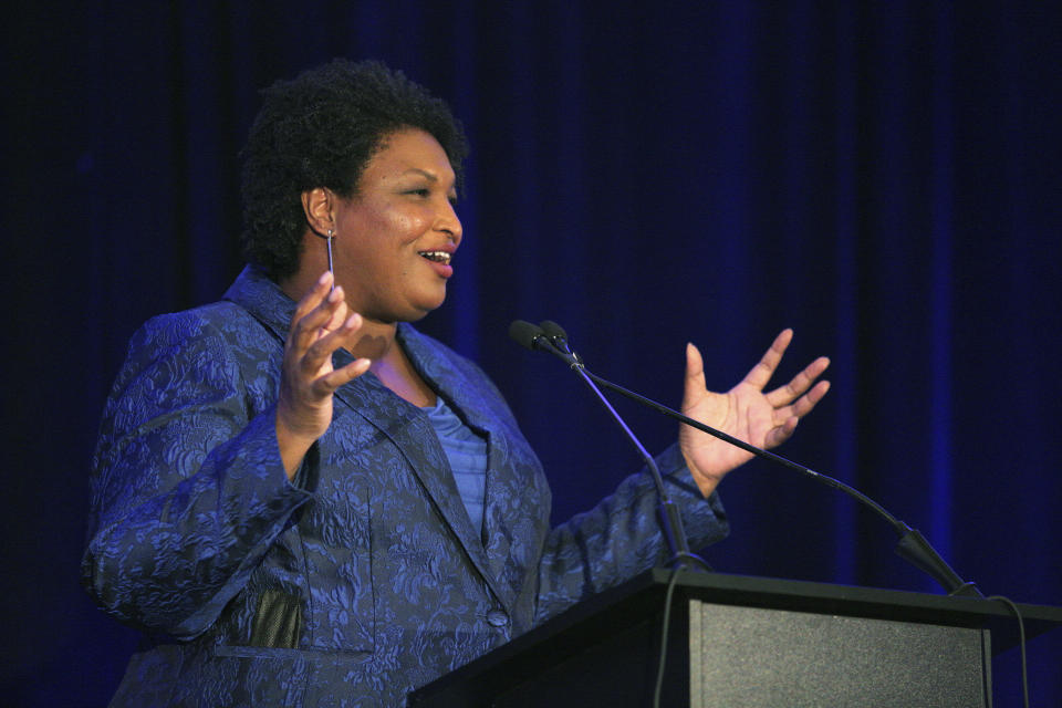 Stacey Abrams addresses the Gwinnett County Democratic Party fundraiser on Saturday, May 21, 2022, in Norcross, Ga. (AP Photo/Akili-Casundria Ramsess)