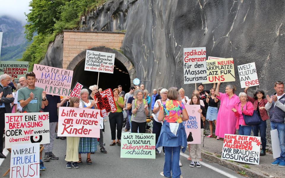 Locals in the Austrian town of Hallstatt took part in a protest against mass tourism