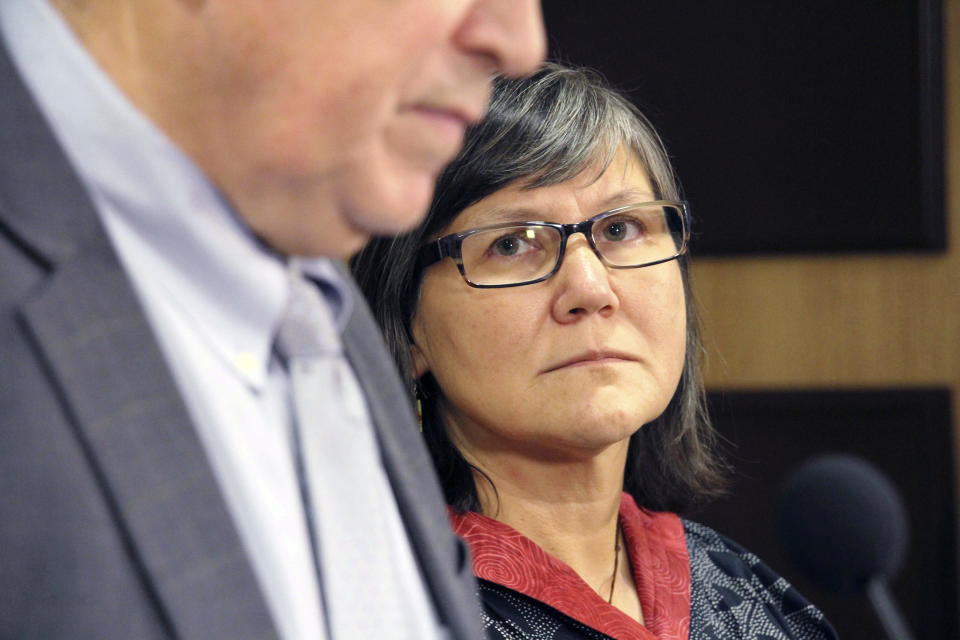 Alaska's new lieutenant governor, Valerie Davidson, right, looks on as Gov. Bill Walker addresses a news conference Tuesday, Oct. 16, 2018, in Anchorage, Alaska. Davidson was sworn in Tuesday after former Lt. Gov. Byron Mallott resigned after the governor's office said he made "inappropriate comments." (AP Photo/Mark Thiessen)