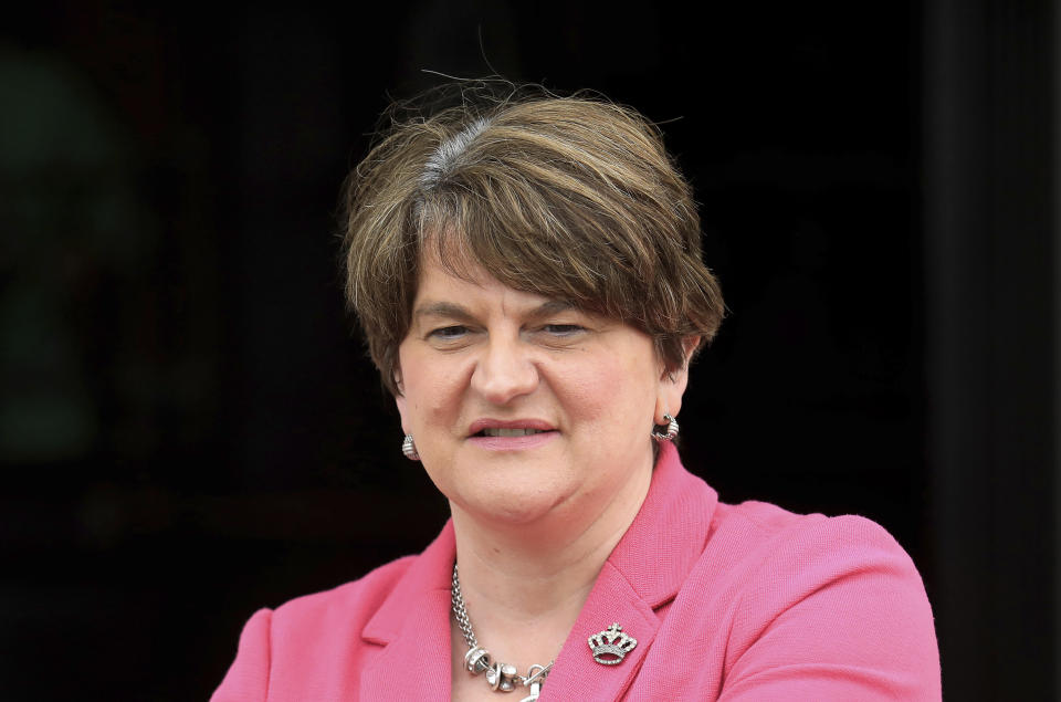 Northern Ireland First Minister Arlene Foster looks at the media on the steps of parliament buildings, Stormont, Belfast, Northern Ireland, Tuesday, June 8, 2021. The First Minister is due to step down later this month after the party leader Edwin Poots announced Tuesday that Paul Givan would take over the position. (AP Photo/Peter Morrison)