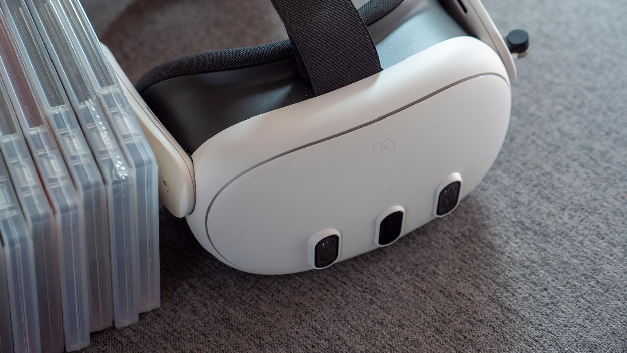  A Meta Quest 3 headset alongside physical game cases. 