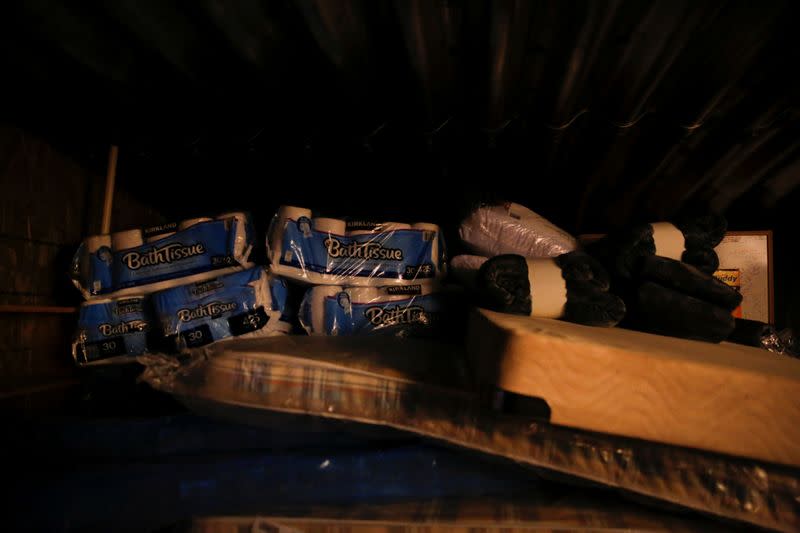 Supplies are stacked to the ceiling in an underground shelter at a survival camp called Fortitude Ranch in southern Colorado
