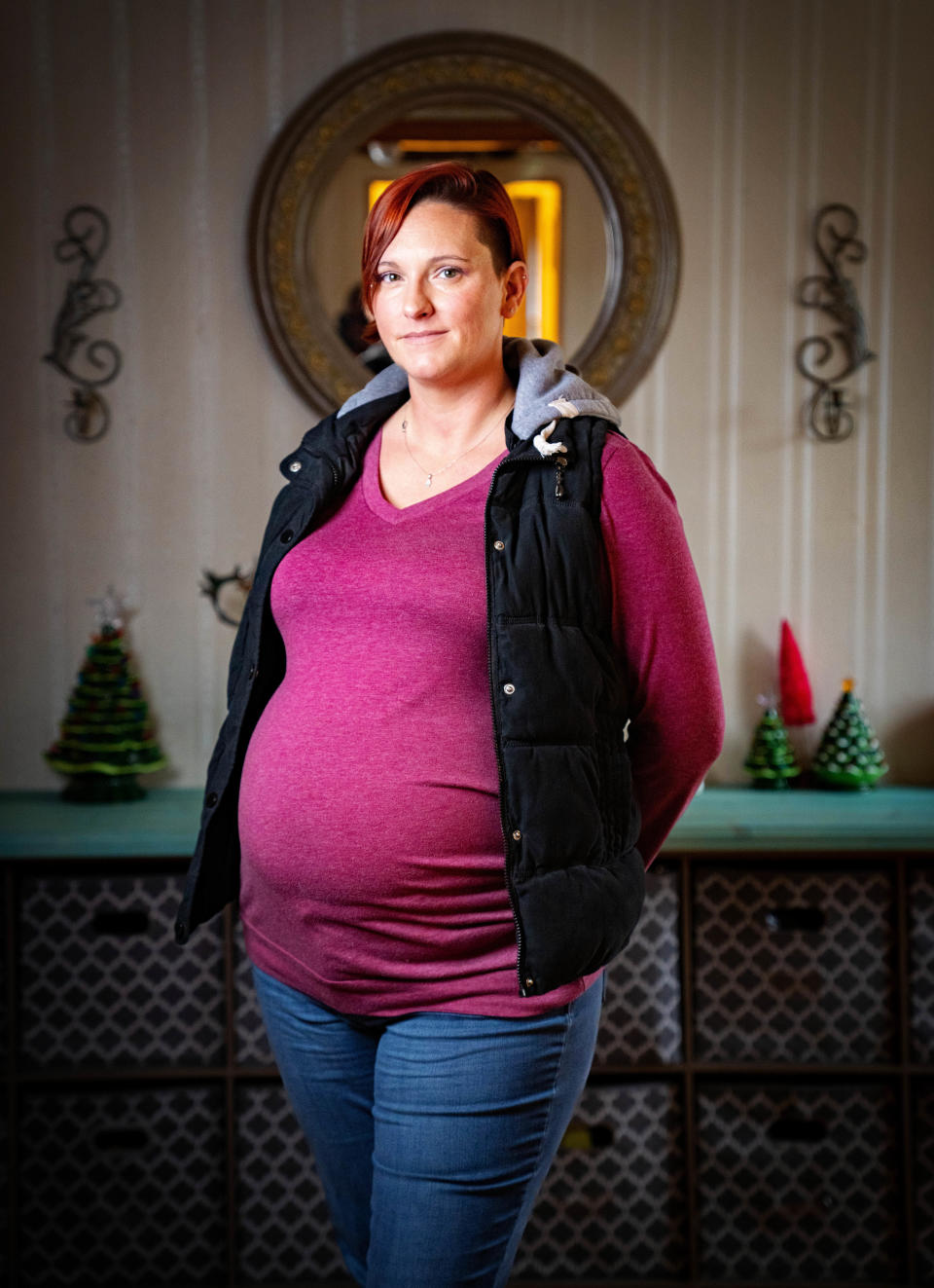 Ashley Greene, who is carrying her third surrogate pregnancy, stands for a photo at her home in Clinton, Wednesday, Dec. 14, 2022.