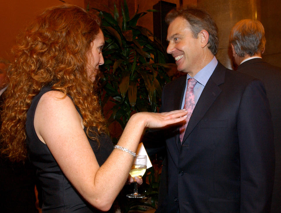 FILE - This Oct. 26, 2004 file photo shows former British Prime Minister Tony Blair with former News International Chief Executive Rebekah Brooks. Jurors at Britain's phone-hacking trial were told Wednesday, Feb. 19, 2014, that former Prime Minister Tony Blair allegedly offered to work as an unofficial adviser to Rupert Murdoch as revelations of illegal phone hacking engulfed the mogul's media empire. (AP Photo/PA, Fiona Hanson, File) UNITED KINGDOM OUT, NO SALES, NO ARCHIVE