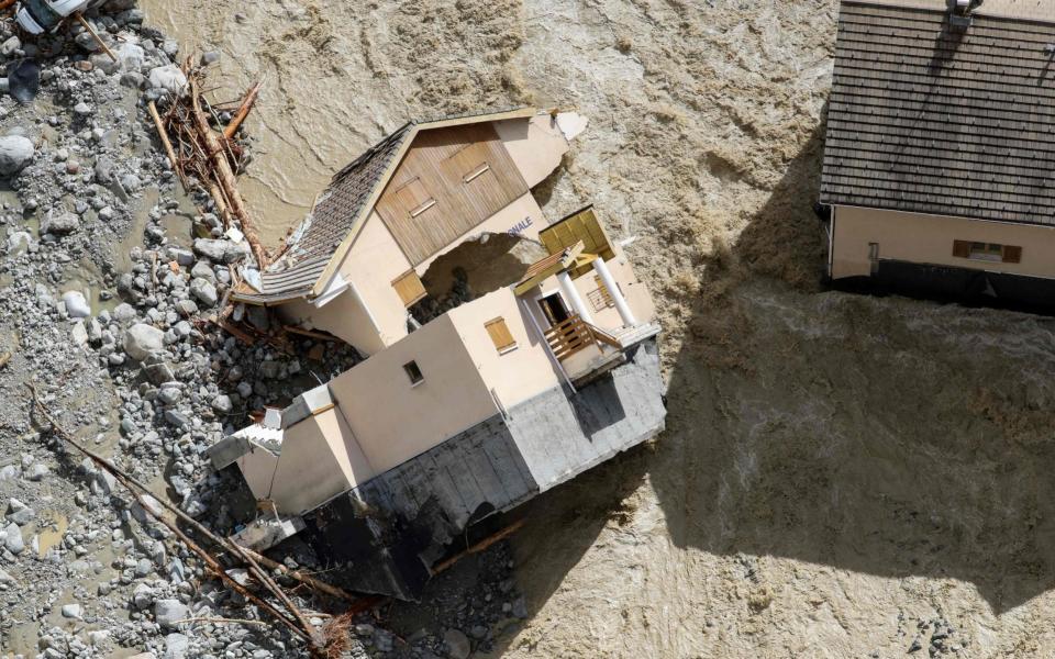 Flood waters surging through Saint-Martin-Vesubie, southeastern France - AFP