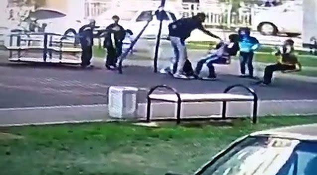 The dad in Russia can be seen approach the children and knocking one of them out in the footage. Photo: CEN