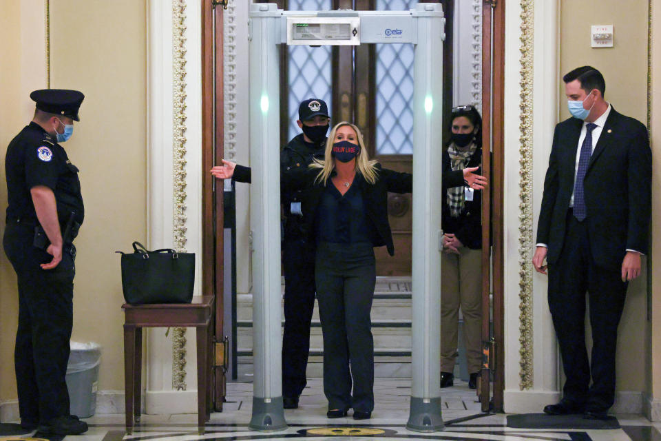 Image: U.S. Representative Marjorie Taylor Greene (R-GA) goes through a new metal detector to enter the House floor in Washington (Jonathan Ernst / Reuters)