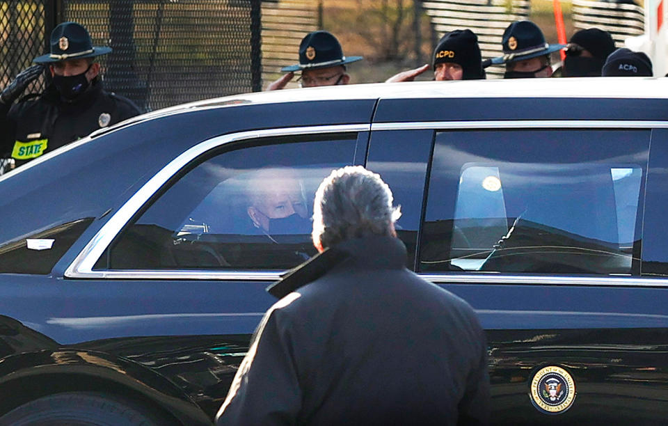 <p>After being sworn in as the 46th President, Biden rides in his limo while police officers salute him.</p>