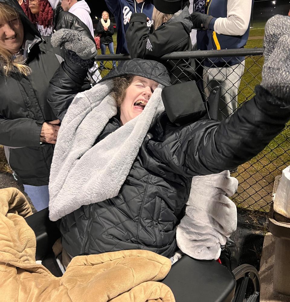 Jennifer Flewellen smiles after her son, Julian, scores a touchdown for Niles in a game against Paw Paw on Friday, Oct. 20, 2023, at Niles High School.