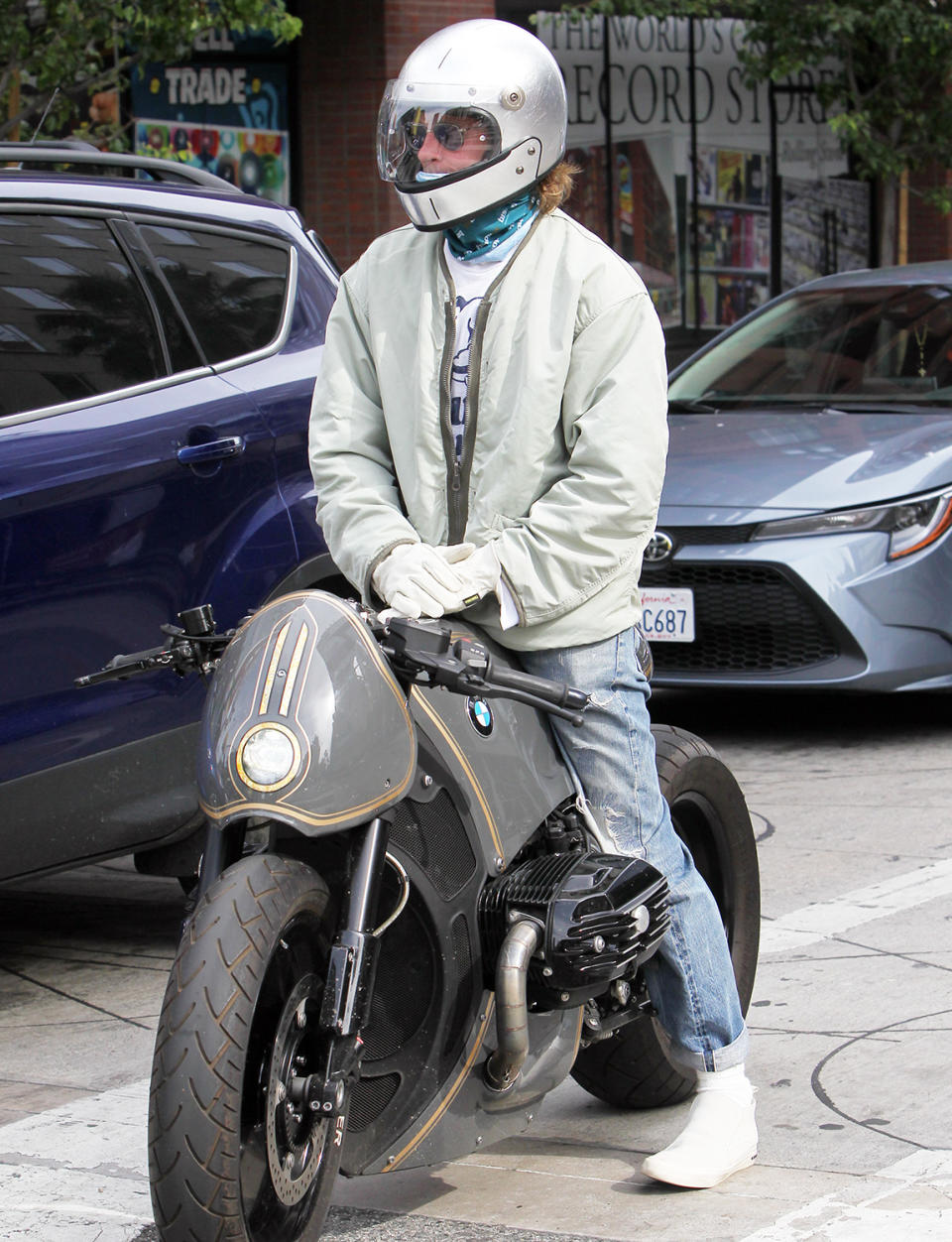 <p>Brad Pitt makes sure to wear a helmet while riding his motorcycle in L.A. on Tuesday. </p>