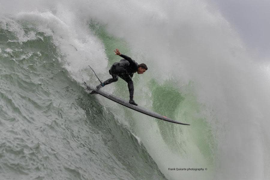 A surfer makes a drop down the wave face on Dec. 27, 2023. (Photo by Frank Quirarte Photography)