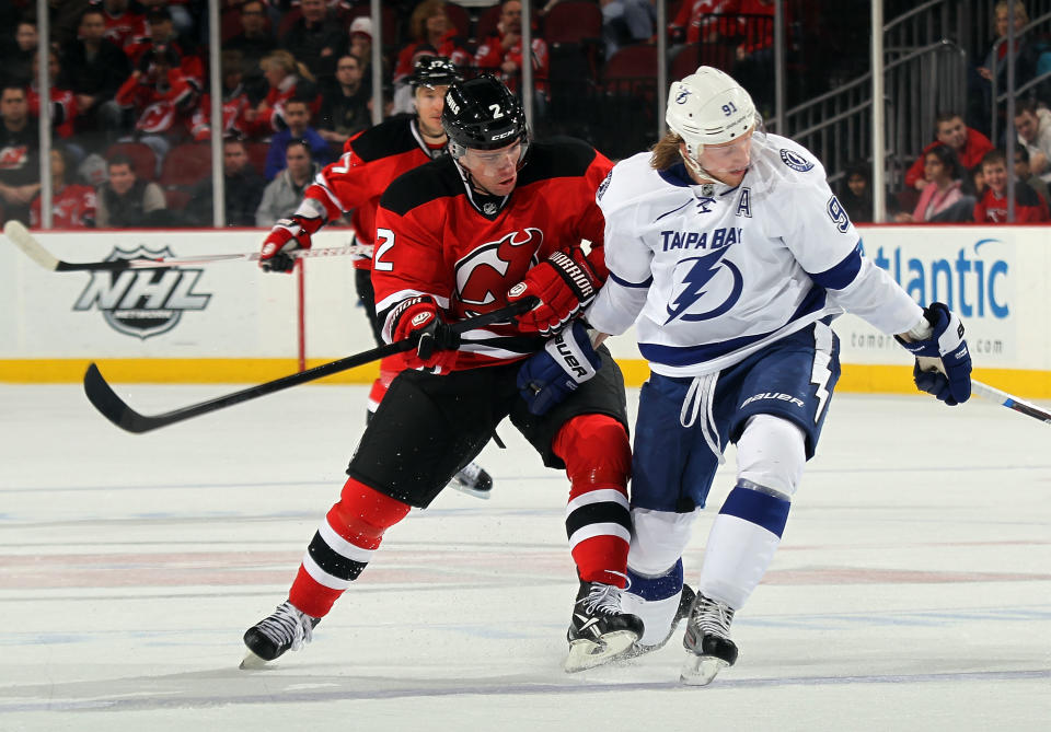 NEWARK, NJ - FEBRUARY 26: Marek Zidlicky #2 of the New Jersey Devils checks Steven Stamkos #91 of the Tampa Bay Lightning at the Prudential Center on February 26, 2012 in Newark, New Jersey. (Photo by Bruce Bennett/Getty Images)
