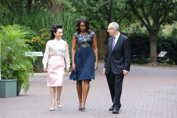 First ladies Michelle Obama of the United States and Peng Liyuan of the People's Republic of China, walk toward the panda habitat at Smithsonian's National Zoo for the panda's naming ceremony today (Sept. 25).