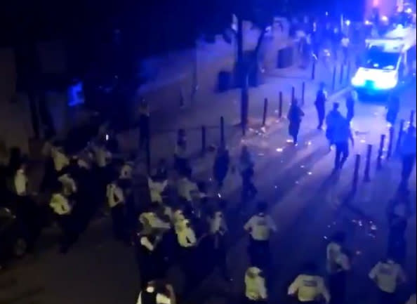 Fifteen police officers were injured in violent clashes in Brixton. (PA)