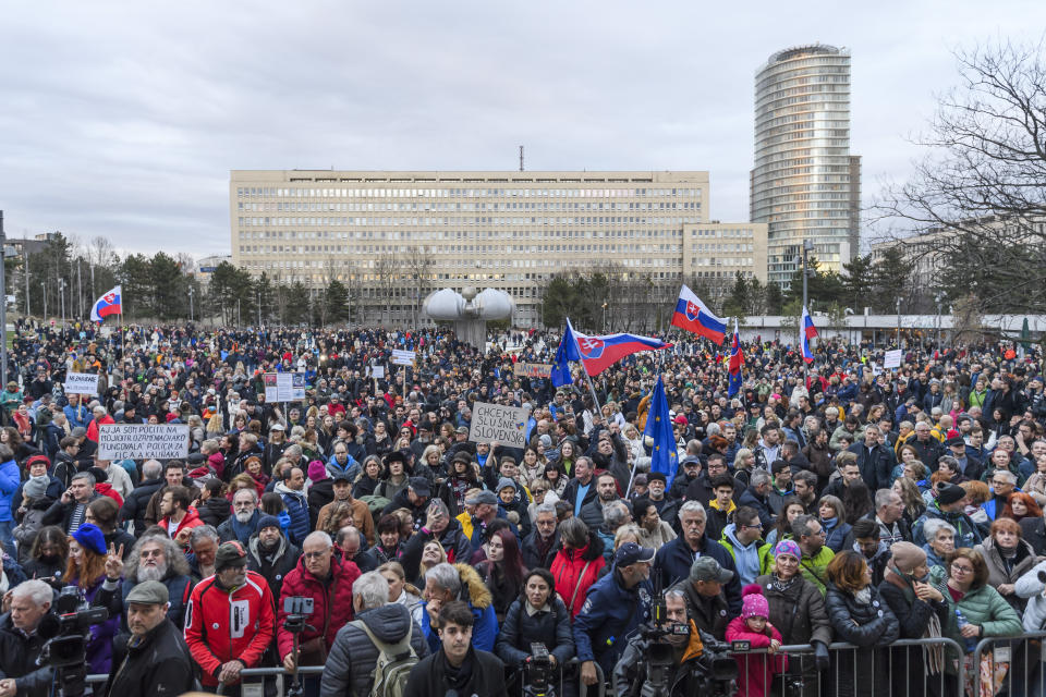 Protesters gather during the initiative ''For a decent Slovakia'', on the 6th anniversary of the murder of Jan Kuciak and Martina Kusnirova, in Bratislava, Slovakia, Wednesday Feb. 21, 2024. Thousands rallied in dozens of cities and towns across Slovakia on Wednesday to mark the sixth anniversary of the slayings of an investigative journalist and his fiancee amid a wave of anti-government protests. (Jaroslav Novák/TASR via AP)