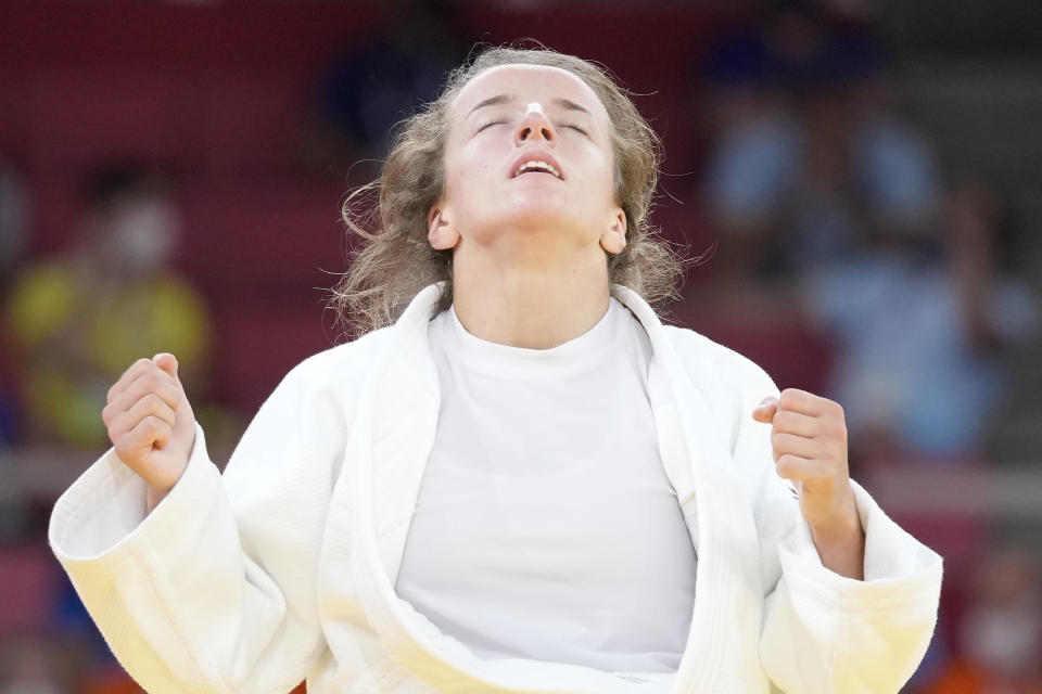 Distria Krasniqi of Kosovo reacts after competing against Funa Tonaki of Japan during their women's -48kg championship judo match at the 2020 Summer Olympics, Saturday, July 24, 2021, in Tokyo, Japan. (AP Photo/Vincent Thian)