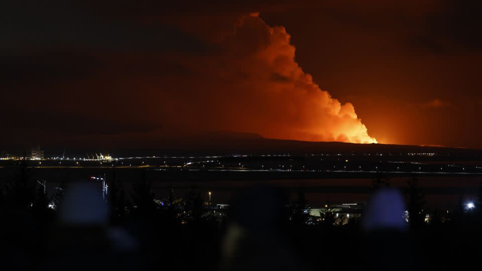 The night sky is illuminated by the eruption. Icelandic authorities have said there are currently no disruptions to flights to and from the country, and international flight corridors remain open. - Brynjar Gunnarsson/AP