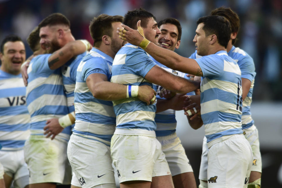 Argentina's Los Pumas Juan Martín González, center, celebrate with teammates after winning the test match against Scotland, in Santiago Del Estero, Argentina, Saturday, July 16, 2022. (AP Photo/Gustavo Garello)