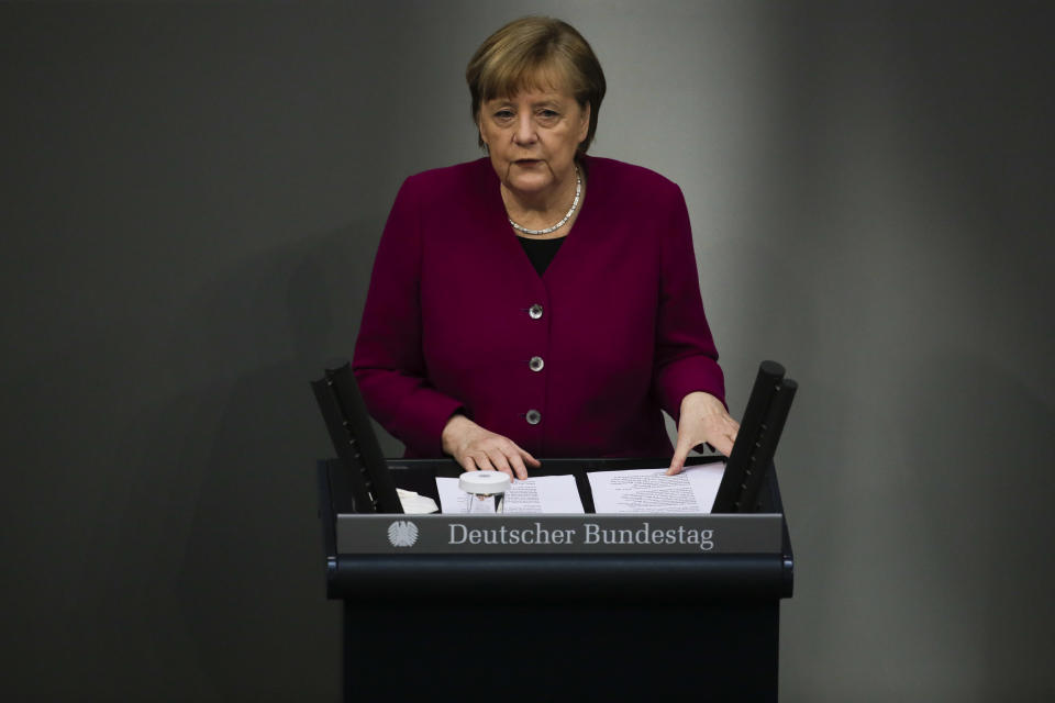 German Chancellor Angela Merkel addresses the German parliament Bundestag ahead of an European Union summit at the Reichstag building in Berlin, Germany, Thursday, March 25, 2021. (AP Photo/Markus Schreiber)