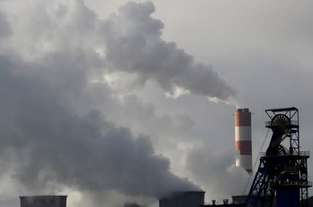 FILE PHOTO: Chimney of Laziska Power Station, a thermal power plant, is seen behind Boleslaw Smialy Coal Mine in Laziska Gorne