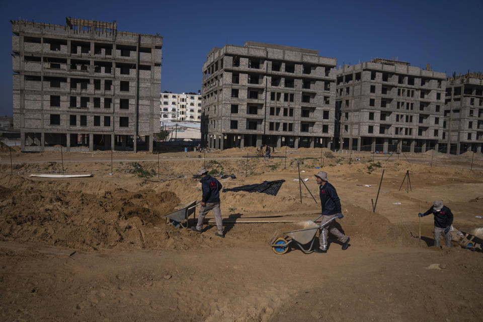 A Palestinian excavation team works in a newly discovered Roman era cemetery in the Gaza Strip, Sunday, Dec. 11, 2022. Hamas authorities in Gaza announced the discovery of over 60 tombs in the ancient burial site. Work crews have been excavating the site since it was discovered last January during preparations for an Egyptian-funded housing project. (AP Photo/Fatima Shbair)