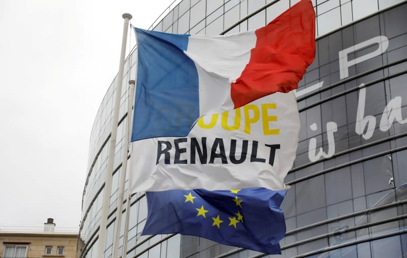FILE PHOTO: French, EU and Renault flags flutter in front of French carmaker Renault headquarters ahead of the company's news conference in Boulogne-Billancourt