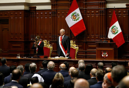 Peru's President Pedro Pablo Kuczynski (C) acknowledges the applause of the audience after receiving the presidential sash during his inauguration ceremony in Lima, Peru, July 28, 2016. REUTERS/Mariana Bazo
