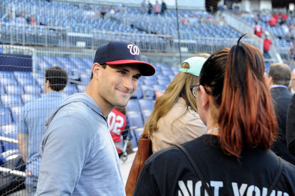 WASHINGTON, DC - MAY 14:  Kirk Cousins of the Washington Redskins talks to fans before the game between the Washington Nationals and the Miami Marlins at Nationals Park on May 14, 2016 in Washington, DC.  (Photo by Greg Fiume/Getty Images)