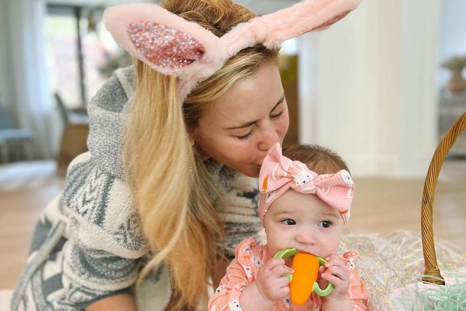 <p>Instagram/taralipinski</p> Tara Lipsinki kisses daughter Georgie on Easter.