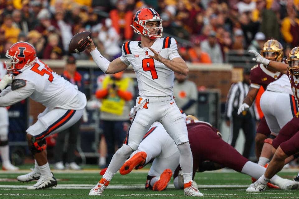 Illinois Fighting Illini quarterback Luke Altmyer (9) throws the ball against the Minnesota Golden Gophers during the second half at Huntington Bank Stadium Nov. 4, 2023.