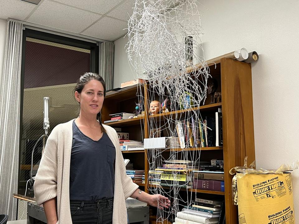 Anna K. Lemnitzer with her sculpted piece of tumble weed and twine titled "Manifestation" for her upcoming exhibition opening Jan. 27.