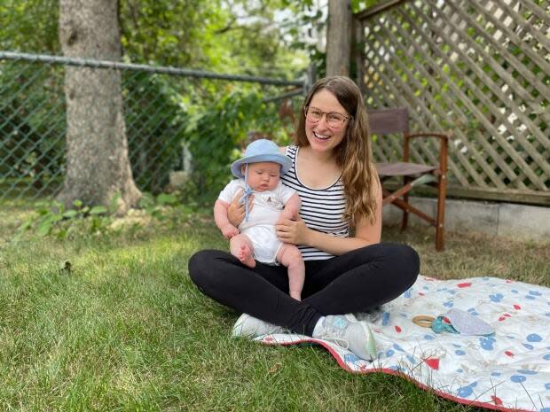 New mother Angela MacDonald said she weighed the risks and benefits before getting the COVID-19 vaccine. (Valeria Cori-Manocchio/CBC - image credit)