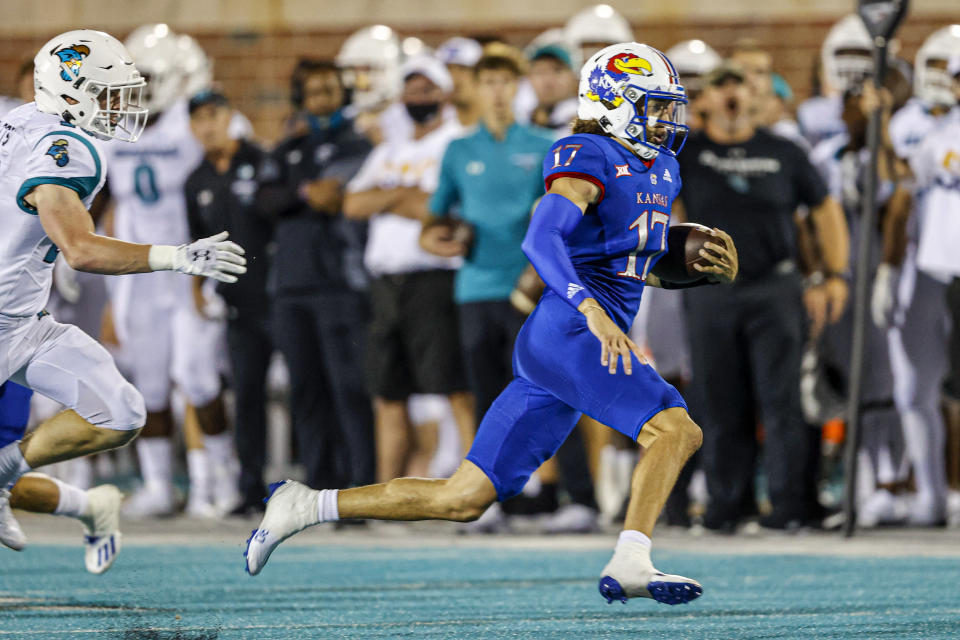 Kansas quarterback Jason Bean runs for a touchdown against Coastal Carolina during the second half of an NCAA college football game in Conway, S.C., Friday, Sept. 10, 2021. Coastal Carolina won 49-22. (AP Photo/Nell Redmond)