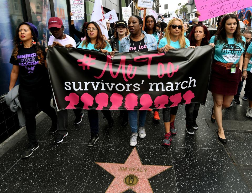 Tarana Burke (center), originator of the #MeToo campaign, leads marchers.