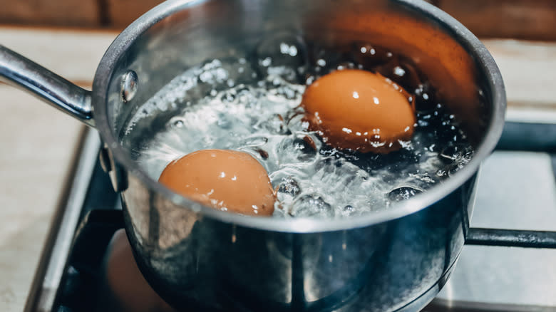 Eggs boiling on stove
