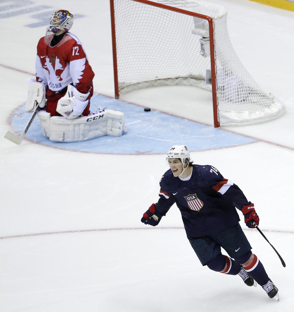 USA forward T.J. Oshie reacts after scoring the winning goal against Russia goaltender Sergei Bobrovski in a shootout during overtime of a men's ice hockey game at the 2014 Winter Olympics, Saturday, Feb. 15, 2014, in Sochi, Russia. (AP Photo/David J. Phillip )