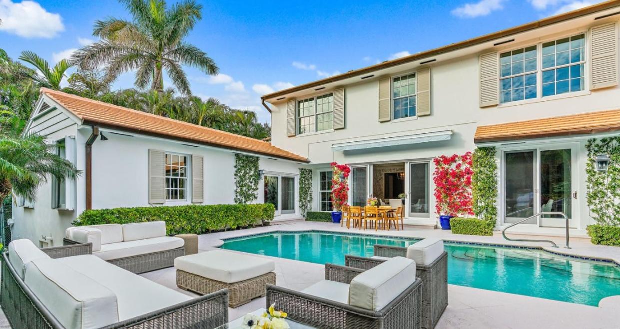The two wings of a house at 310 Plantation Road in Palm Beach wrap around the swimming pool. The house was just sold for a recorded $10.2 million by a seller who simultaneously bought a vacant lot nearby for $10.25 million.