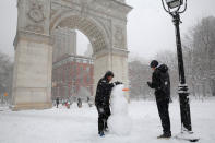 <p>People build a snowman in Washington Square Park as snow falls in, New York, Feb. 9, 2017. (Photo: Andrew Kelly/Reuters) </p>