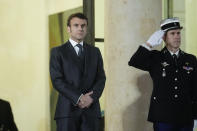 French President Emmanuel Macron, waits for arrival of German Chancellor Olaf Scholz before their meeting with Ukraine's President Volodymyr Zelenskyy at the Elysee Palace in Paris, France, Wednesday, Feb. 8, 2023. Western support has been key to Kyiv's surprisingly stiff defense, and the two sides are engaged in grinding battles. (AP Photo/Thibault Camus)