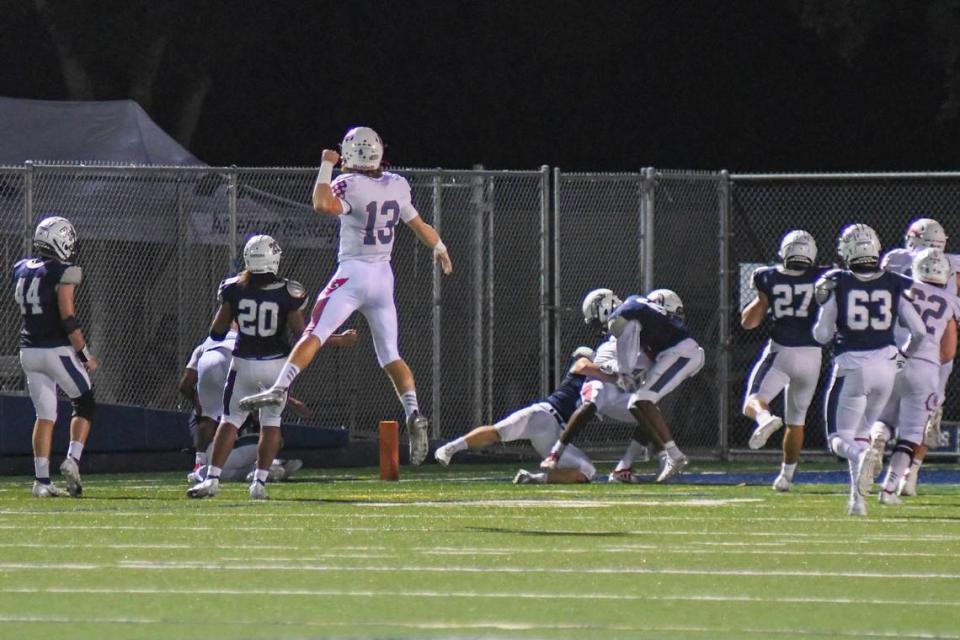 Cardinal Gibbons quarterback Mason Polivka celebrates after throwing a first-half touchdown against Delray American Heritage in the Region 4-4A finals on Friday, Nov. 27, 2020.